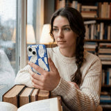 Electric Blue Snowy Owls iPhone 14 Case - Lifestyle photo showing phone case in use