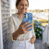 Electric Blue Blue Groove iPhone 14 Case - Lifestyle photo showing phone case in use