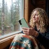 Sage Green Samsung S25 Phone Case - Lifestyle photo showing phone case in use