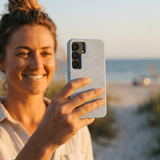 Powder Blue Ebb and Flow Samsung Galaxy S25 Case - Lifestyle photo showing phone case in use
