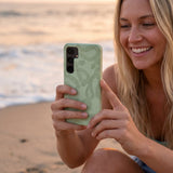Sage Green Snaky Samsung Galaxy S25 Case - Lifestyle photo showing phone case in use