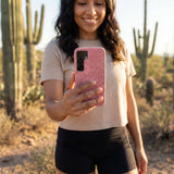 Bubblegum Pink Flora Samsung Galaxy S25 Case - Lifestyle photo showing phone case in use