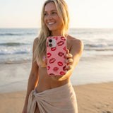 Bubblegum Pink XOXO iPhone 16 Case - Lifestyle photo showing phone case in use