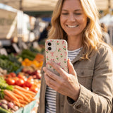 Seashell Tulip Bliss iPhone 16 Pro Max Case - Lifestyle photo showing phone case in use