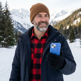 Electric Blue Hockey Postage iPhone 14 Case - Lifestyle photo showing phone case in use