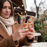 Seashell Jolly Doggos Samsung Galaxy S25 Case - Lifestyle photo showing phone case in use