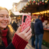 Bubblegum Pink Candy Cane Chaos Samsung Galaxy S25 Case - Lifestyle photo showing phone case in use
