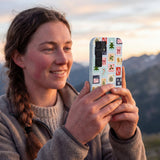 Powder Blue Noel Stamps Samsung Galaxy S25 Case - Lifestyle photo showing phone case in use