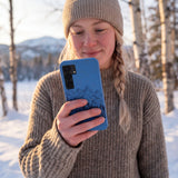 Electric Blue Backcountry Ski Samsung Galaxy S25 Case - Lifestyle photo showing phone case in use