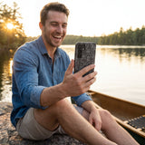 Black Play Sketch Samsung Galaxy S25 Case - Lifestyle photo showing phone case in use