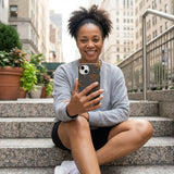 Black Jaguar Stars iPhone 14 Case - Lifestyle photo showing phone case in use