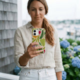 Seashell Veggie Patch iPhone 16 Case - Lifestyle photo showing phone case in use