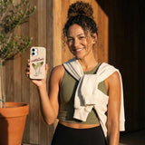 Seashell Pickletinis iPhone 14 Case - Lifestyle photo showing phone case in use