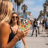 Sage Green Fresh Picnic iPhone 14 Case - Lifestyle photo showing phone case in use