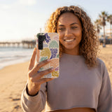 Seashell Coral Dreams Samsung Galaxy S25 Case - Lifestyle photo showing phone case in use