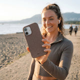 Chocolate Brown Leaf Veins iPhone 17 Case - Lifestyle photo showing phone case in use