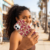 Seashell Flower Stack iPhone 17 Case - Lifestyle photo showing phone case in use