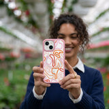 Clear Sweet Doodles iPhone 17 Case With Petal Pink Ridge (MagSafe included) - Lifestyle photo showing phone case in use