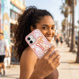 Clear Sweet Doodles iPhone 17 Case With Petal Pink Ridge (MagSafe included) - Lifestyle photo showing phone case in use