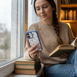 Clear Rosette Frame iPhone 17 Case With True Blue Ridge (MagSafe included) - Lifestyle photo showing phone case in use