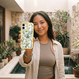 Clear Daffodil Bouquet iPhone 17 Pro Case With Sunbeam Ridge (MagSafe included) - Lifestyle photo showing phone case in use