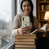 Clear Daffodil Bouquet iPhone 17 Case With Sunbeam Ridge (MagSafe included) - Lifestyle photo showing phone case in use