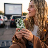 Clear Green Glow iPhone 17 Case With Forest Floor Ridge (MagSafe included) - Lifestyle photo showing phone case in use