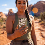 Clear Serpent Sketch iPhone 17 Case With Forest Floor Ridge (MagSafe included) - Lifestyle photo showing phone case in use