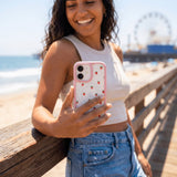 Clear Summer Berries iPhone 17 Case With Petal Pink Ridge (MagSafe included) - Lifestyle photo showing phone case in use