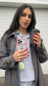 Clear Summer Berries iPhone 17 Pro Max Case With Petal Pink Ridge (MagSafe included) - Lifestyle photo showing phone case in use