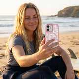 Clear Rosy Bows iPhone 17 Case With Petal Pink Ridge (MagSafe included) - Lifestyle photo showing phone case in use