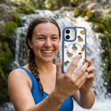 Clear Fancy Frogs iPhone 17 Pro Case With True Blue Ridge (MagSafe included) - Lifestyle photo showing phone case in use