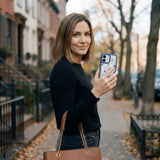 Clear Black and Blue iPhone 17 Case With True Blue Ridge (MagSafe included) - Lifestyle photo showing phone case in use