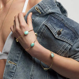 A simple and elegant everyday bangle with three faceted oval shaped Amazonite gemstones. This handmade and sustainable gold bangle only enhances the gorgeous green tones of the natural gemstones.