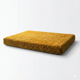 Yellow textured dog bed on a white background