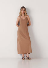 Full-length model wearing black canvas slingback sandal wedge espadrilles with a natural jute platform