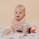 cute baby tummy time in milk tea bib