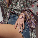 A simple and elegant everyday bangle with three faceted oval shaped lolite gemstones. This handmade and sustainable gold bangle only enhances the gorgeous purple and lilac tones of the natural gemstones. This bangle does not have a clasp and slips over your wrist. Sustainable materials are 14 Carat gold vermeil