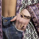 A simple and elegant everyday bangle with three faceted oval shaped lolite gemstones. This handmade and sustainable gold bangle only enhances the gorgeous purple and lilac tones of the natural gemstones. This bangle does not have a clasp and slips over your wrist. Sustainable materials are 14 Carat gold vermeil