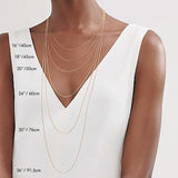 Kati Kaia amethyst mala necklace worn as layered gold chains on model in white top showing lengths