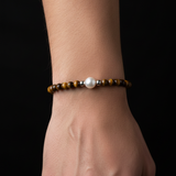 Man's wrist wearing Tigers Eye Pearl Bracelet - smaller beads