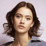 Our Lilly Thin Twisted Gold Hoop Earrings are simple enough to wear to the beach, yet detailed enough to accompany your powersuit.
