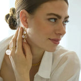 These gorgeous chandelier earrings each feature four pear shaped multifaceted Pink Quartz gemstones. Pink Quartz is the birthstone for January and is known as the gemstone of universal love. It restores trust and harmony in relationships, encouraging unconditional love.