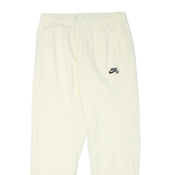 NIKE Mens Joggers Cream L W30 L28 Slim Tapered Fit SB Logo Elastic Waist
