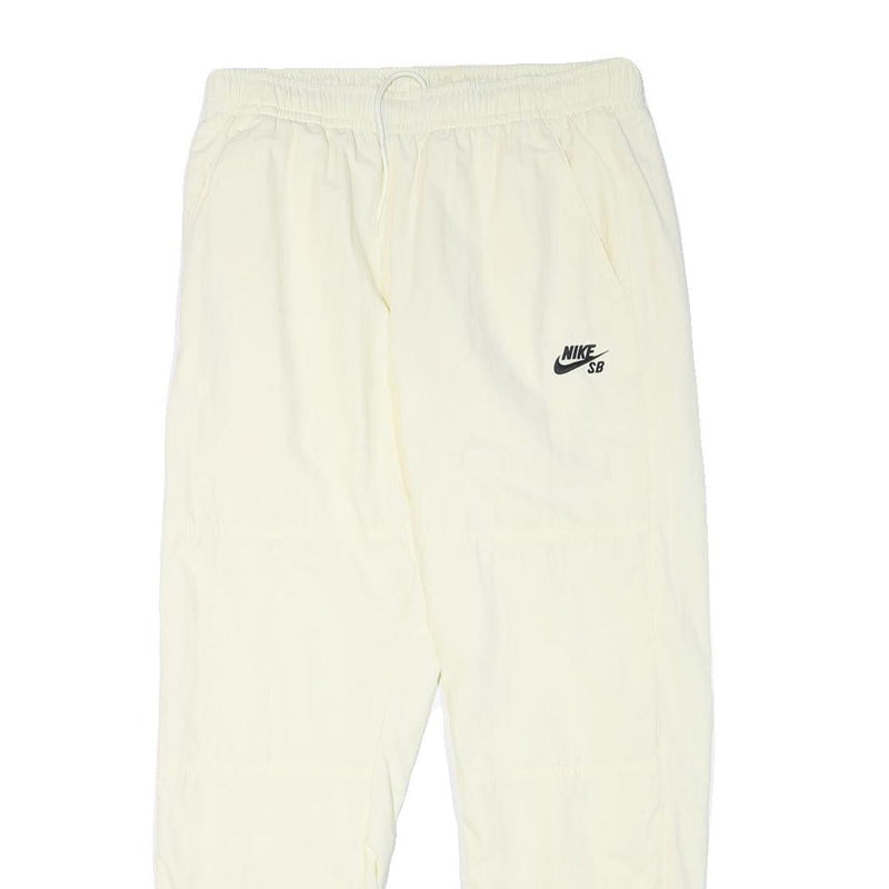 NIKE Mens Joggers Cream L W30 L28 Slim Tapered Fit SB Logo Elastic Waist