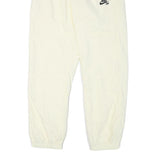 NIKE Mens Joggers Cream L W30 L28 Slim Tapered Fit SB Logo Elastic Waist