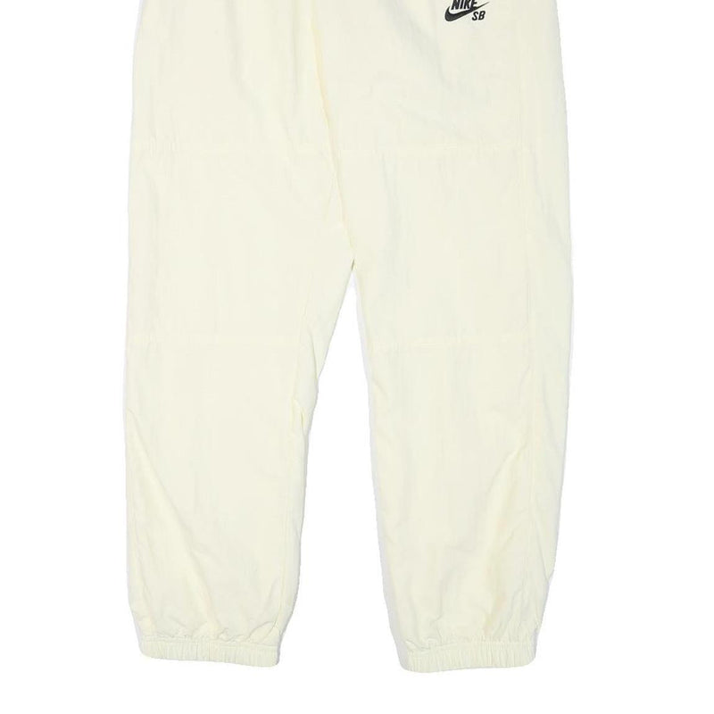NIKE Mens Joggers Cream L W30 L28 Slim Tapered Fit SB Logo Elastic Waist