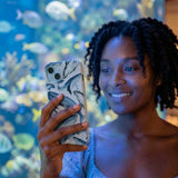 Powder Blue Whales iPhone 14 Case - Lifestyle photo showing phone case in use