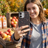 Black Night Garden iPhone 15 Case - Lifestyle photo showing phone case in use