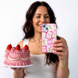 Bubblegum Pink Love Letters iPhone 14 Case - Lifestyle photo showing phone case in use